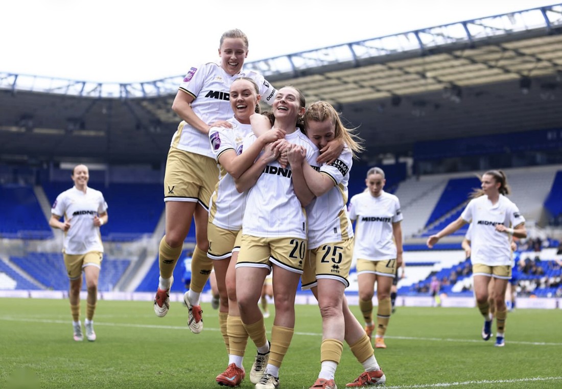 Players celebrating together on the pitch